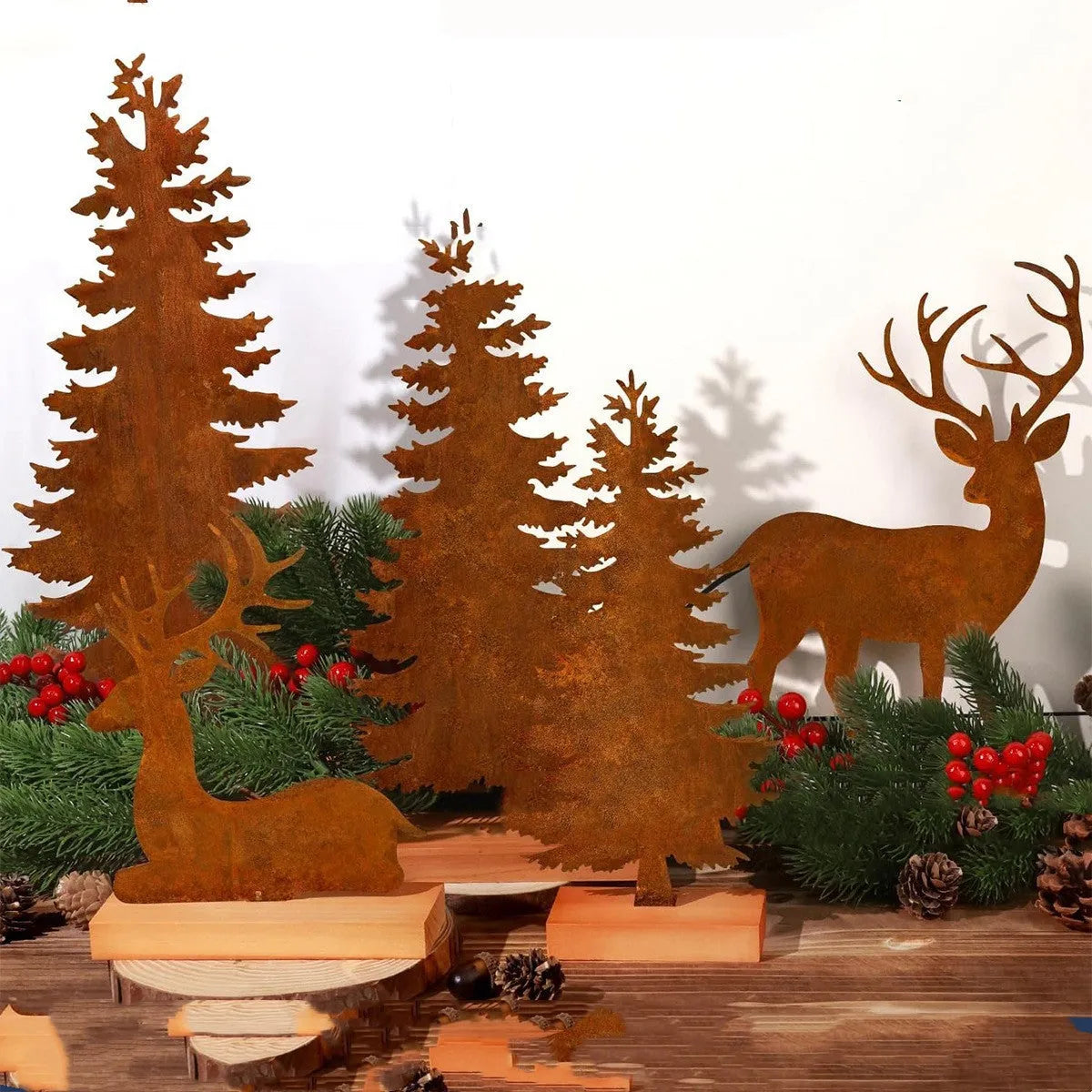 Set of three rusty metal Christmas ornaments featuring elk and tree designs.