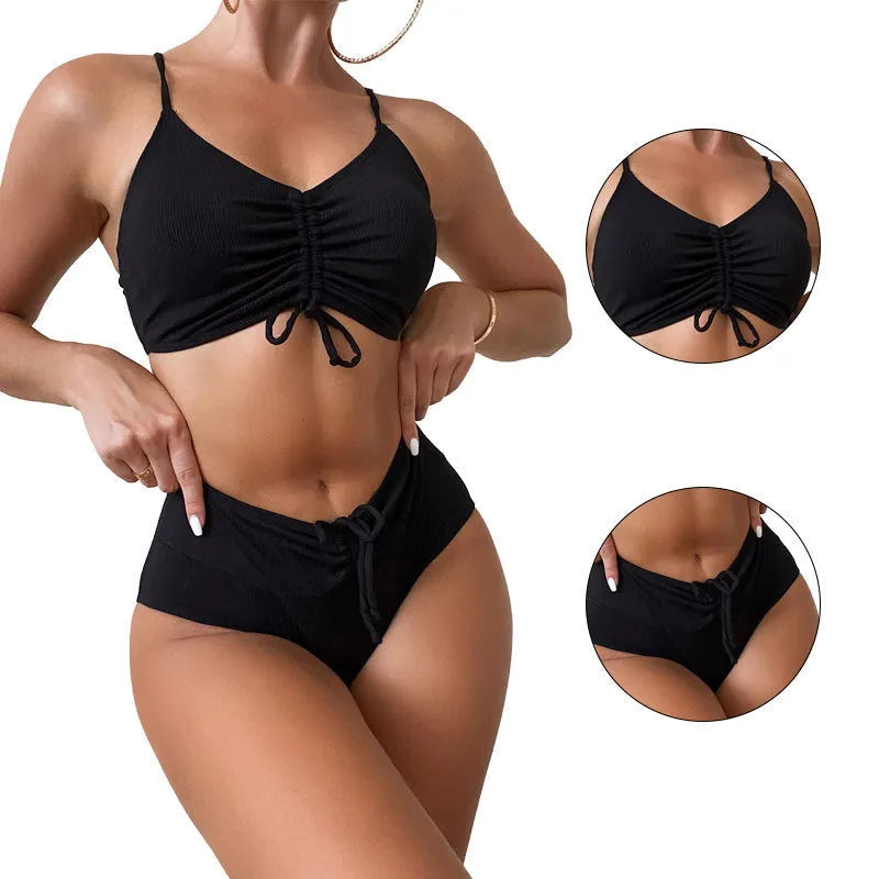 Black women's high-waist bikini with sling split design on shorts and sleeveless top.