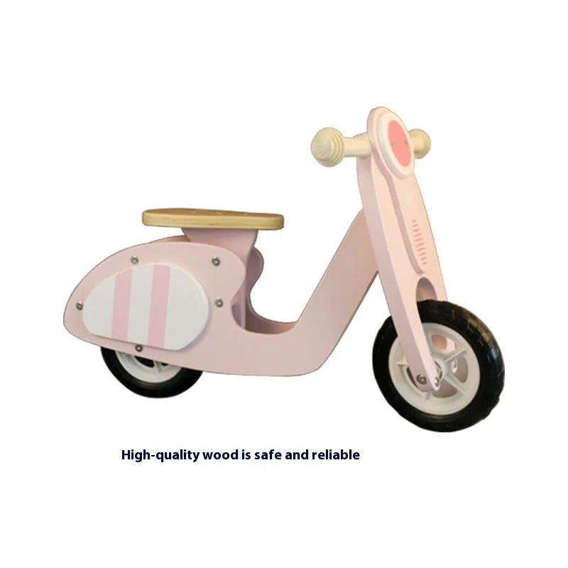 Pink wooden toddler balance scooter on a 10-inch wooden deck for children ages 1 to 6.