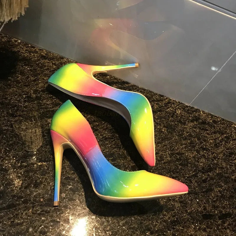 Rainbow glossy patent leather women's stiletto heels with a pointed toe and thin high heel.
