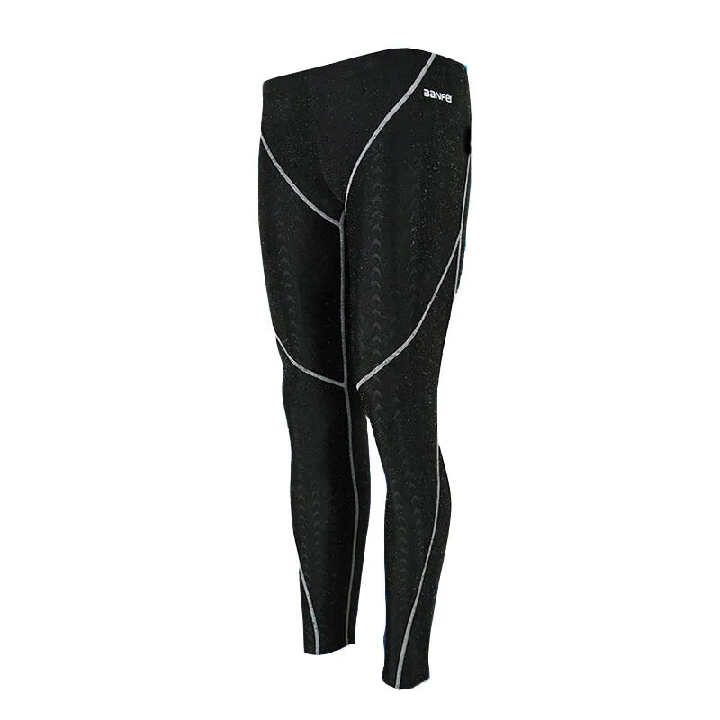 Men's black cropped nylon swimming trunks with mesh lining, shown on size chart