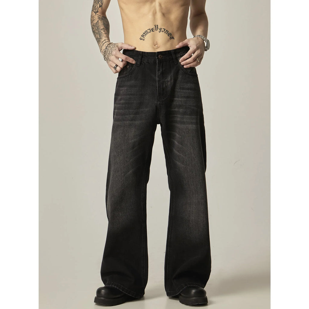 Black straight leg jeans with loose retro styling and basic zip fly design