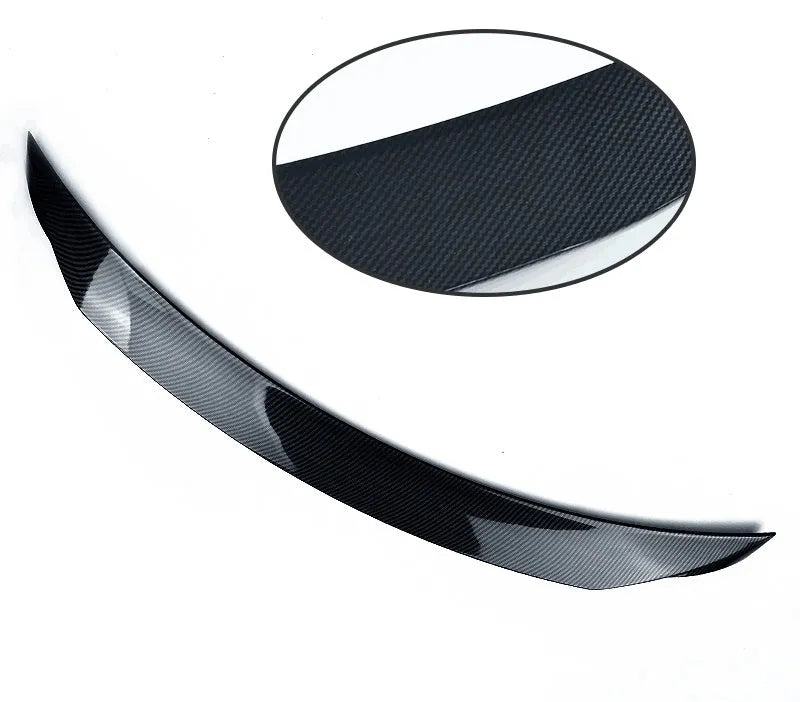 Bright black Mazda 3 Axela Exela tail trim for 2014-2021 models showing large fixed wind surrounded blade design