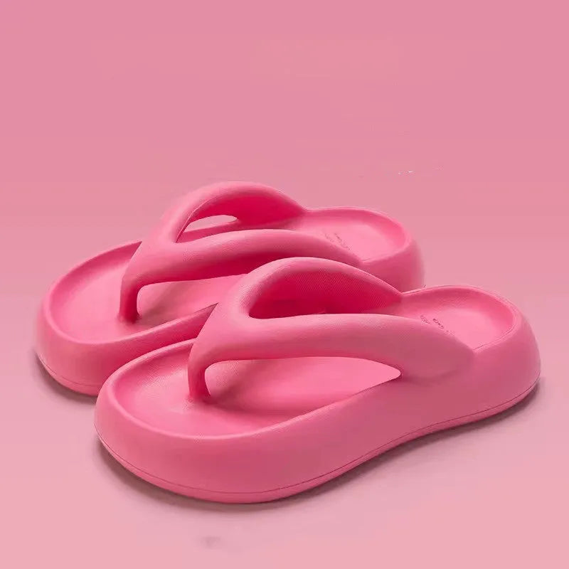 A pair of EVA thick-soled flip-flops with a bow detail on the upper, shown in one of the available colours.