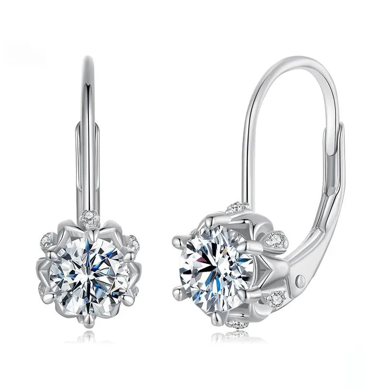 A pair of sterling silver flower bud design ear clips with white gold plating and moissanite stones.