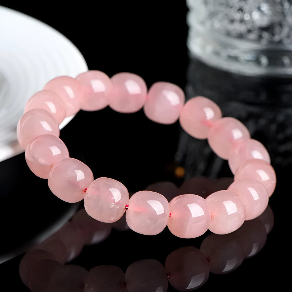 Pink natural crystal barrel bead bracelet with 8x10mm geometric design and polished finish