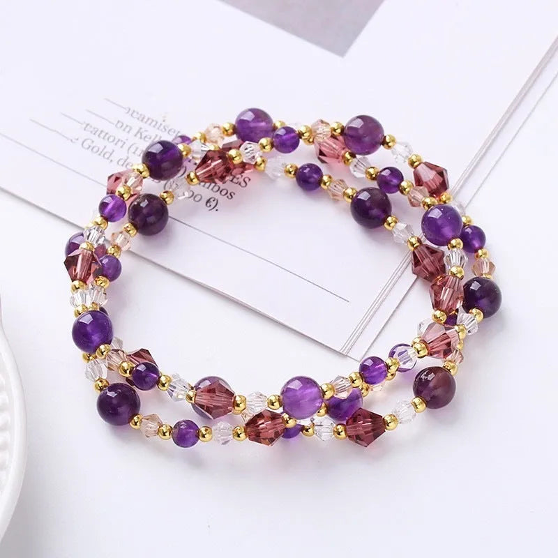 Colourful three-ring crystal bracelet with tourmaline, strawberry quartz, and amethyst beads on an adjustable cord.