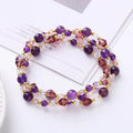 Colourful three-ring crystal bracelet with tourmaline, strawberry quartz, and amethyst beads on an adjustable cord.