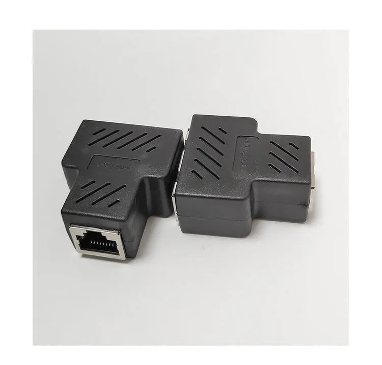 Two white RJ45 network cable splitters showing three female Ethernet ports each.