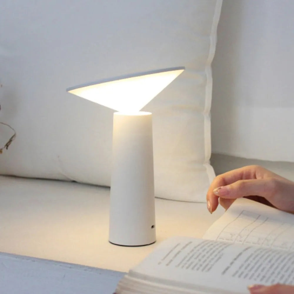 Black USB LED table lamp with touch controls and adjustable 40-degree lamp head on wooden surface