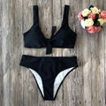 Solid colour bikini set in polyester fabric on a white background.