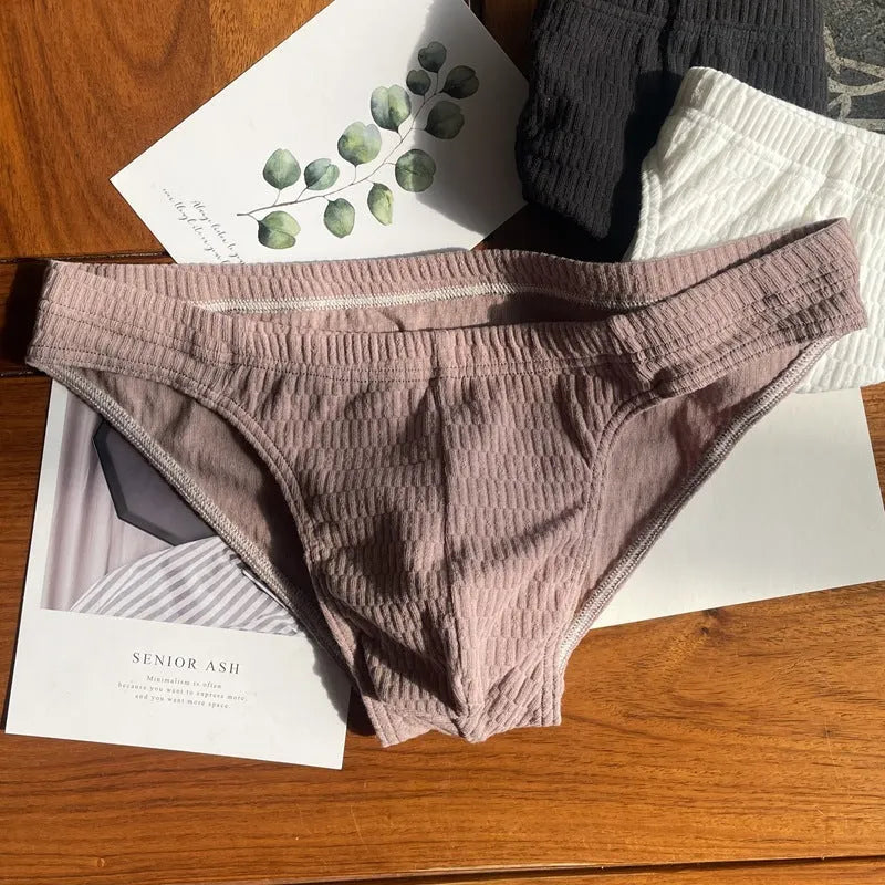 Men's solid colour pure cotton triangle briefs with a mid-waist body-shaping design.