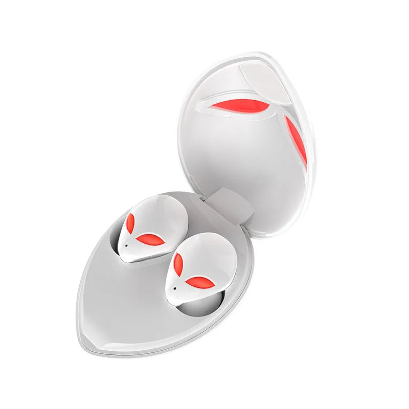 Creative Outer T8 Starman alien design wireless earbuds with LED lights next to charging case.