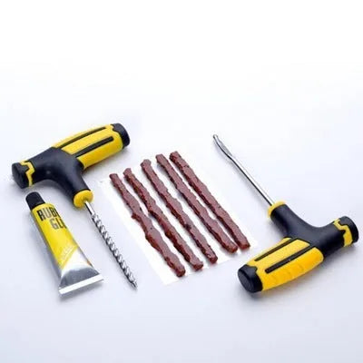 Vacuum tyre repair tool kit with black and yellow case containing probe, pin, glue and rubber strips