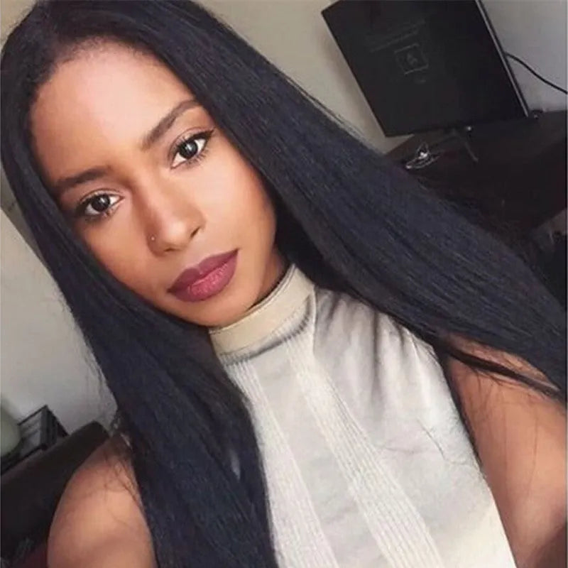 Long straight black synthetic wig with centre-parted bangs on a model.