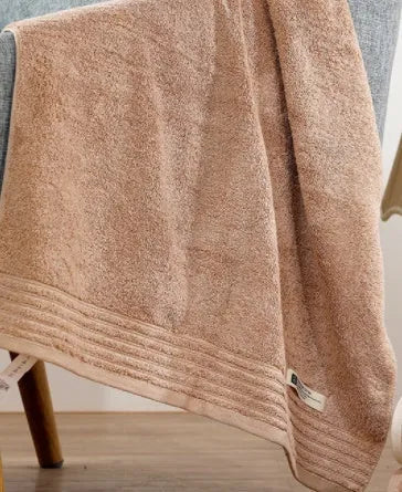 Cotton towel set in beige and brown with 395 GSM weight including bath towel, hand towel, and face cloth