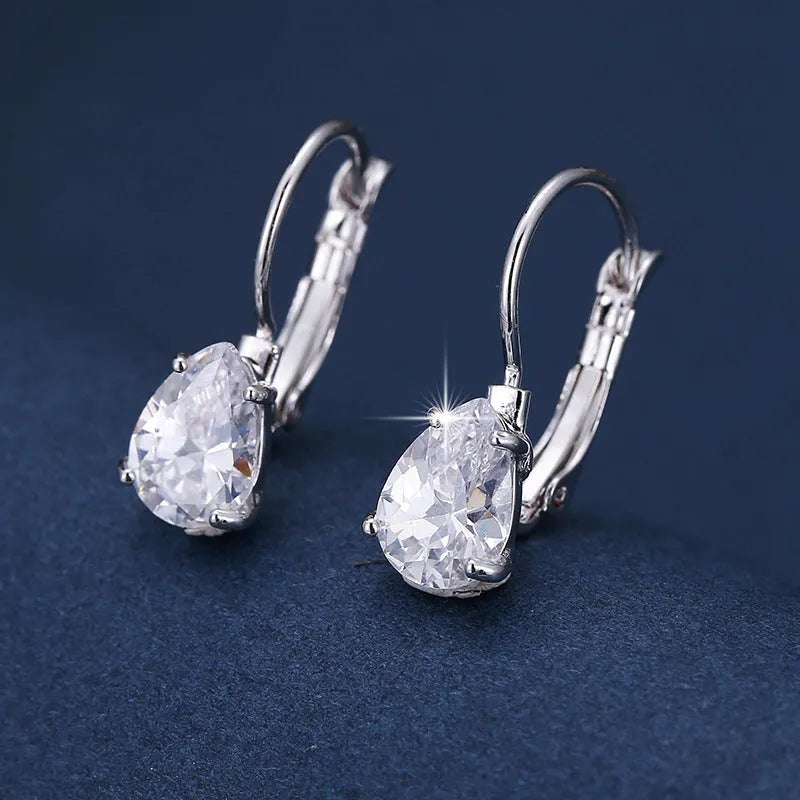 Gold and platinum coloured drop-shaped fashion earrings with metallic finish