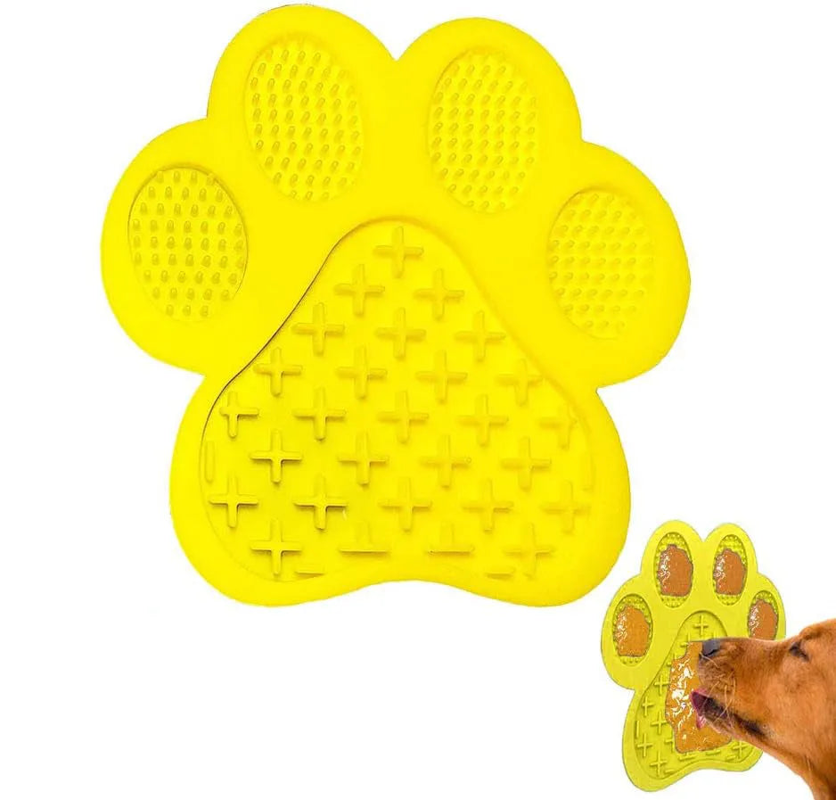 Blue bone-textured silicone dog licking mat with suction cups on back, shown on a tiled wall.
