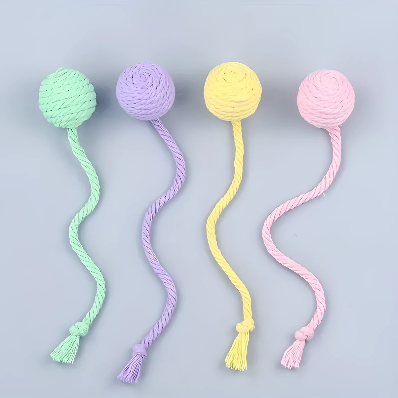 Colourful cat toy ball with rope tail and internal jingle bell in two size options