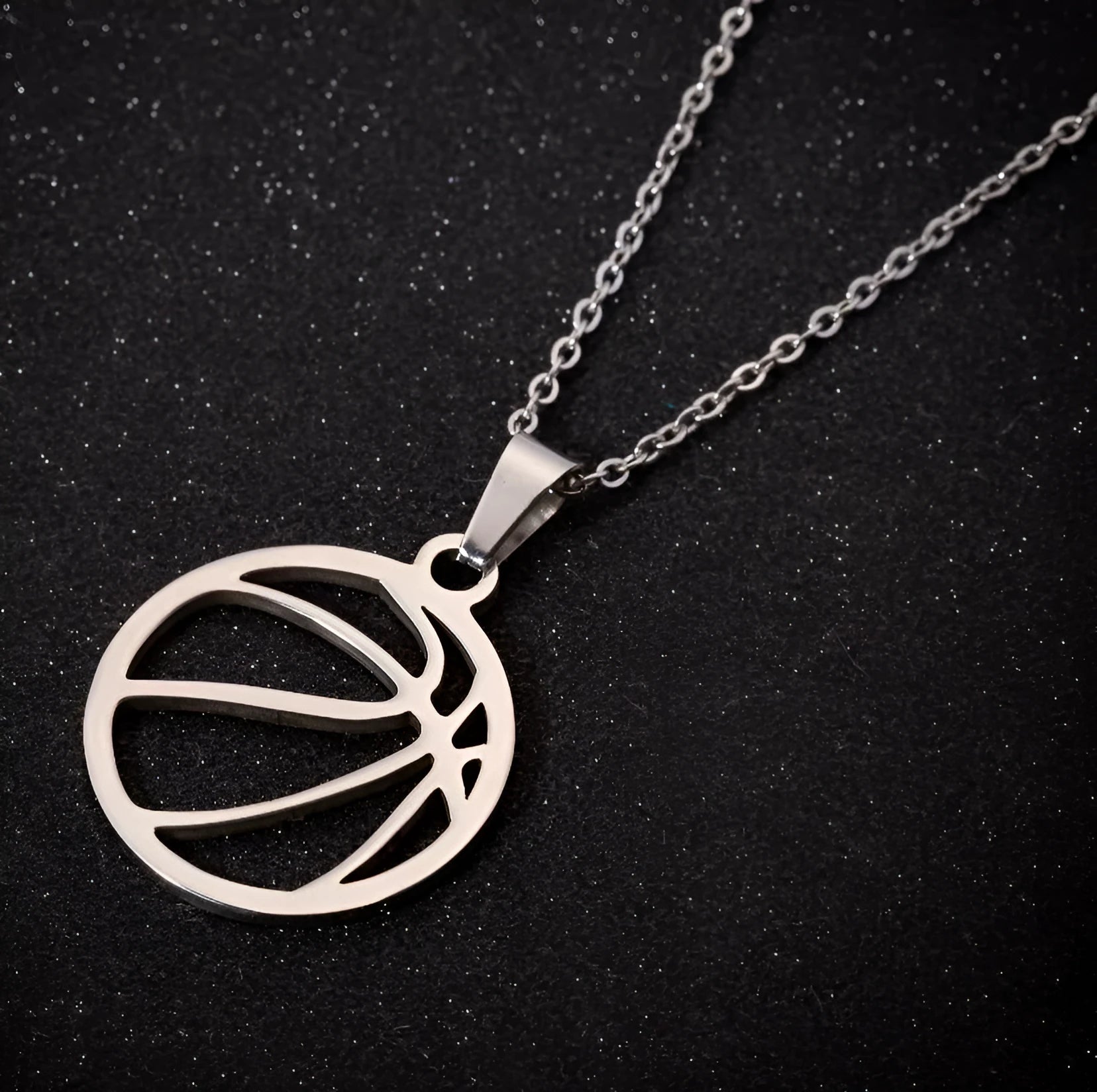 Gold stainless steel volleyball pendant necklace on display with chain and 3cm extender