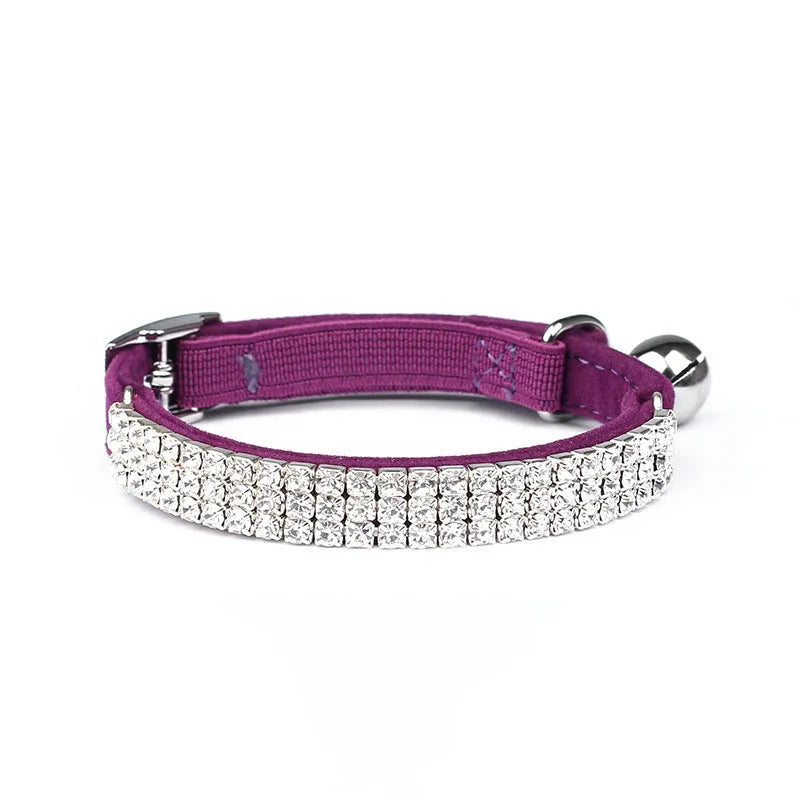 Soft red velvet cat collar with rhinestones, shown adjusted to fit.