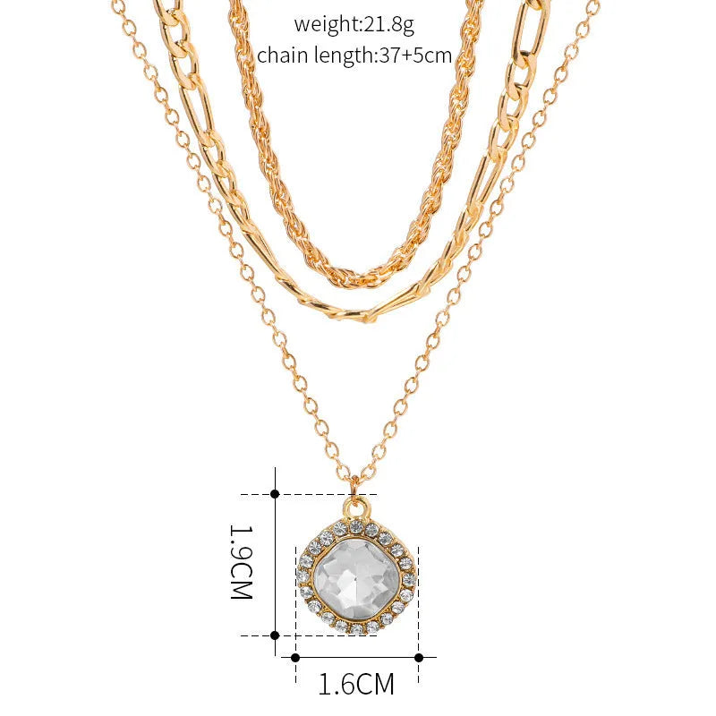 Gold multi-layer pendant necklace with large hemp flowers chain and geometric round pendant on woman