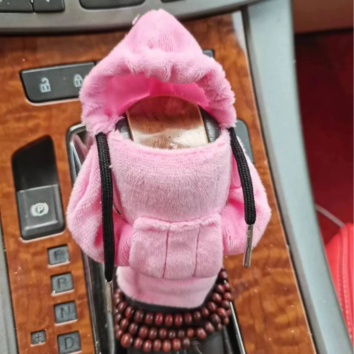 Dutch velvet car gear handle sleeve cover in multiple colours on a car gear lever.