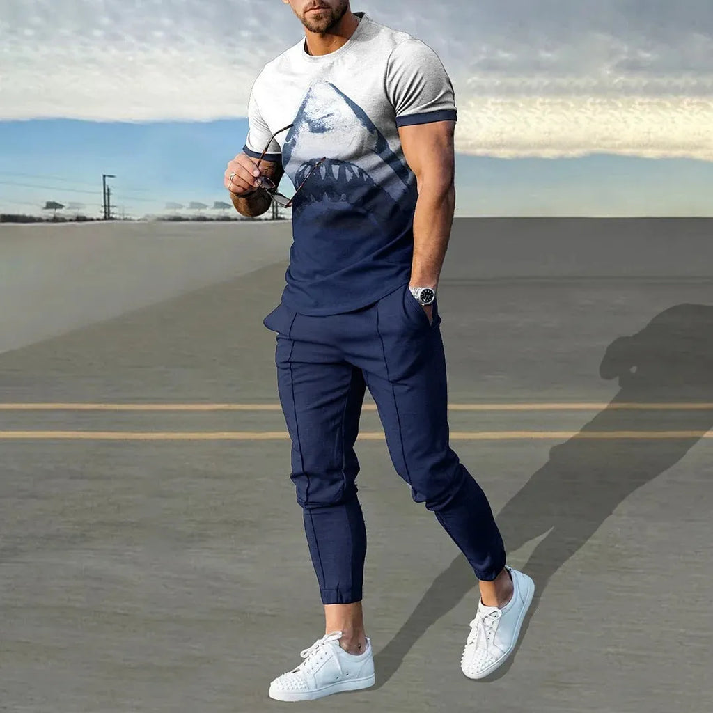 Men's short sleeve printed top and trouser sport suit set in polyester blend fabric.