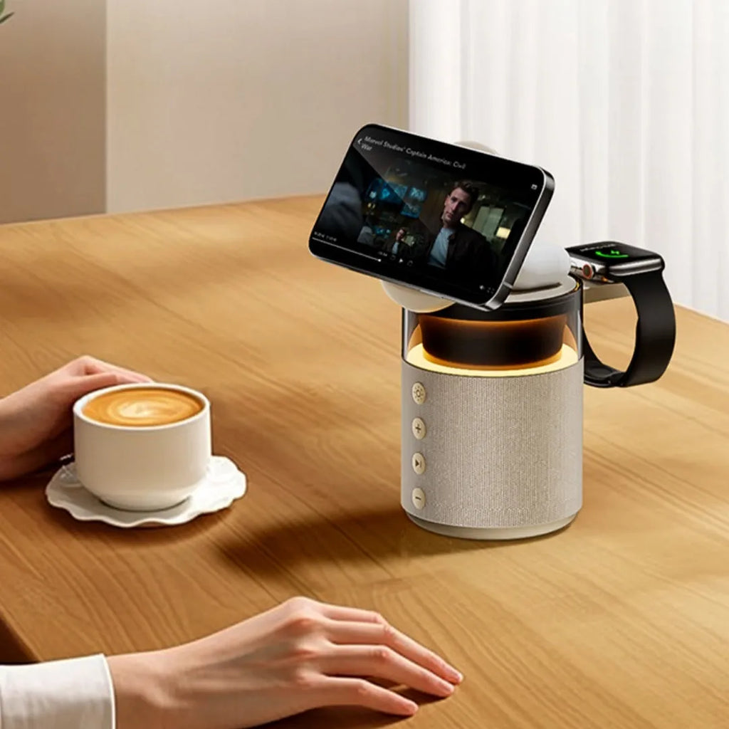 White three-in-one wireless magnetic Bluetooth charger with lighting on a household desk