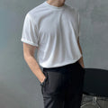 Men's slim fit cotton T-shirt in solid white colour on a hanger.