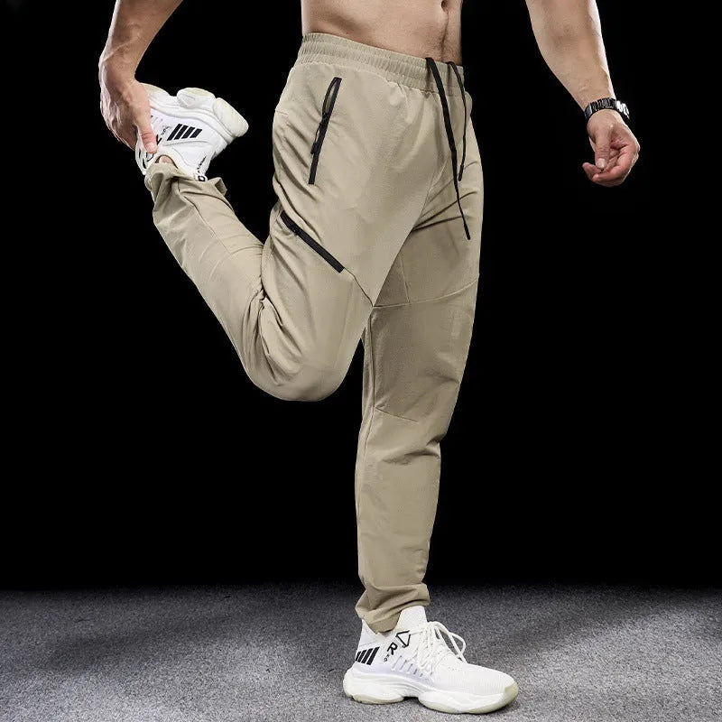 Men's nylon workout pants in mid-waist cut with quick-drying properties for sports and fitness