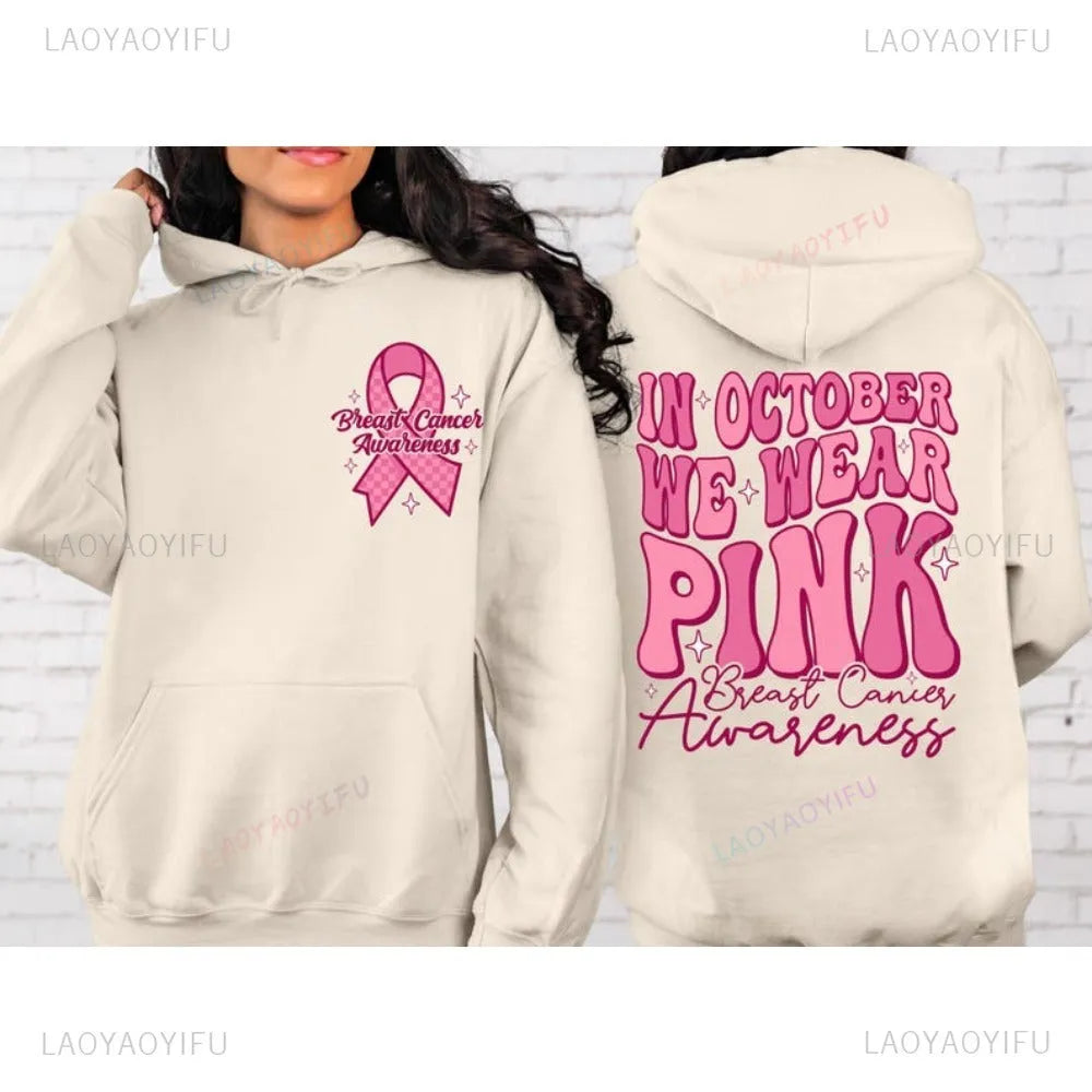 Pink breast cancer awareness pullover hoodie with retro art print and side seam pockets.
