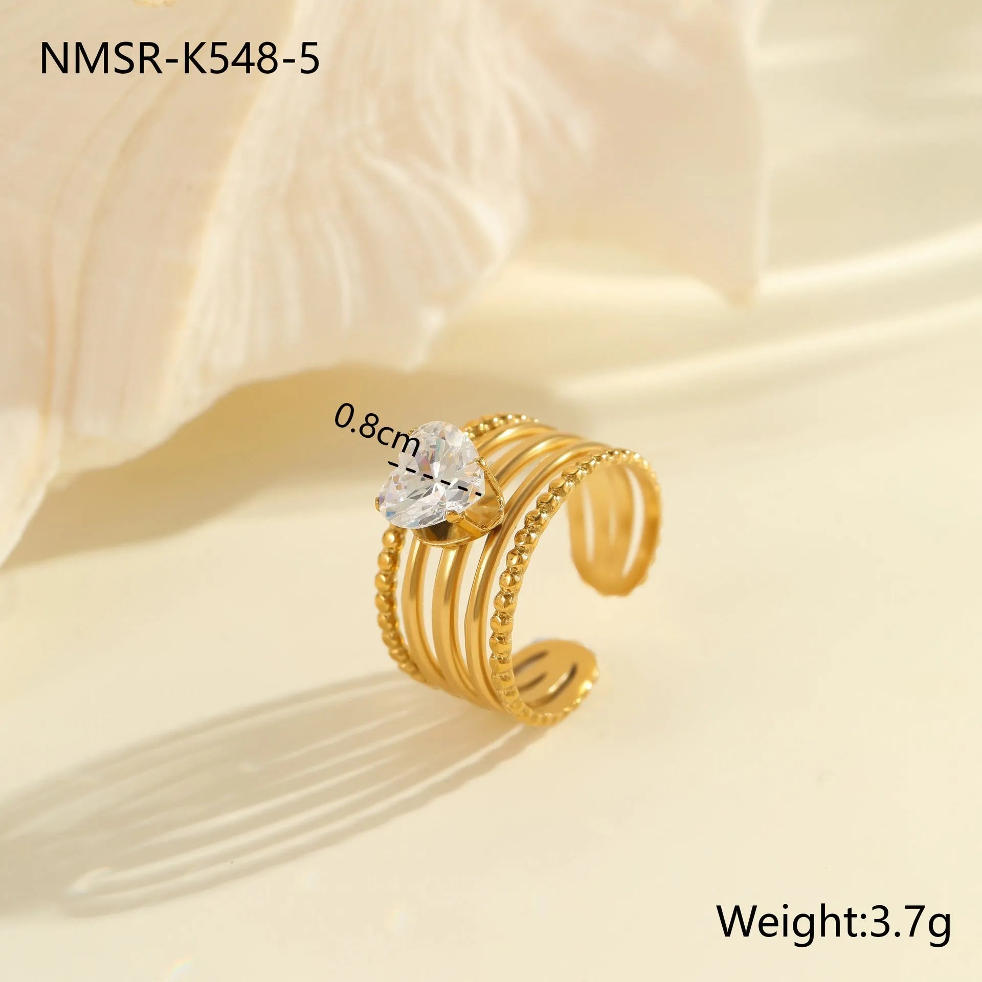 Stainless steel women's ring with gold electroplating and zircon details in geometry design