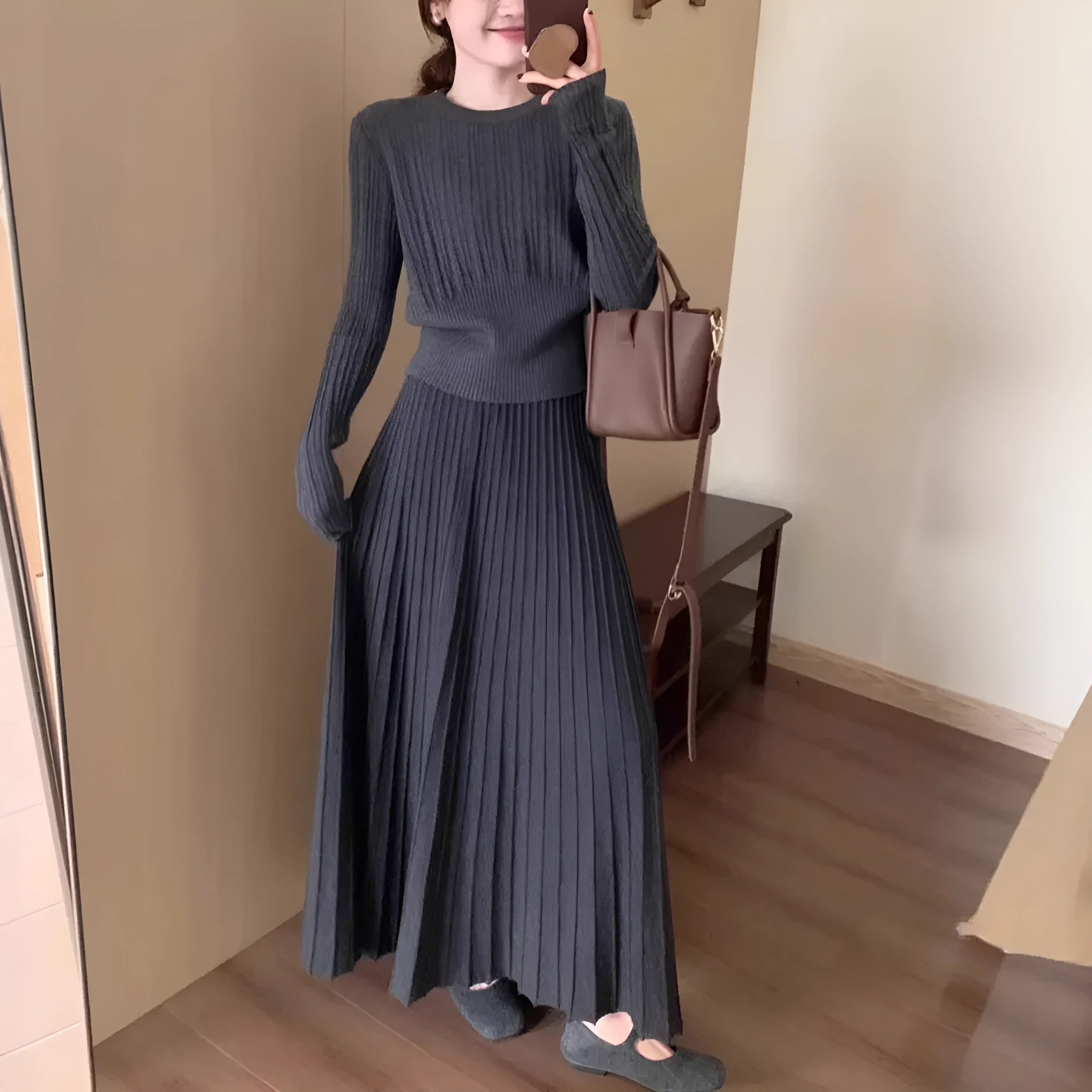 Knitted dress suit set with 3D pattern ethnic style showing sweater and skirt coordination in dark grey colour