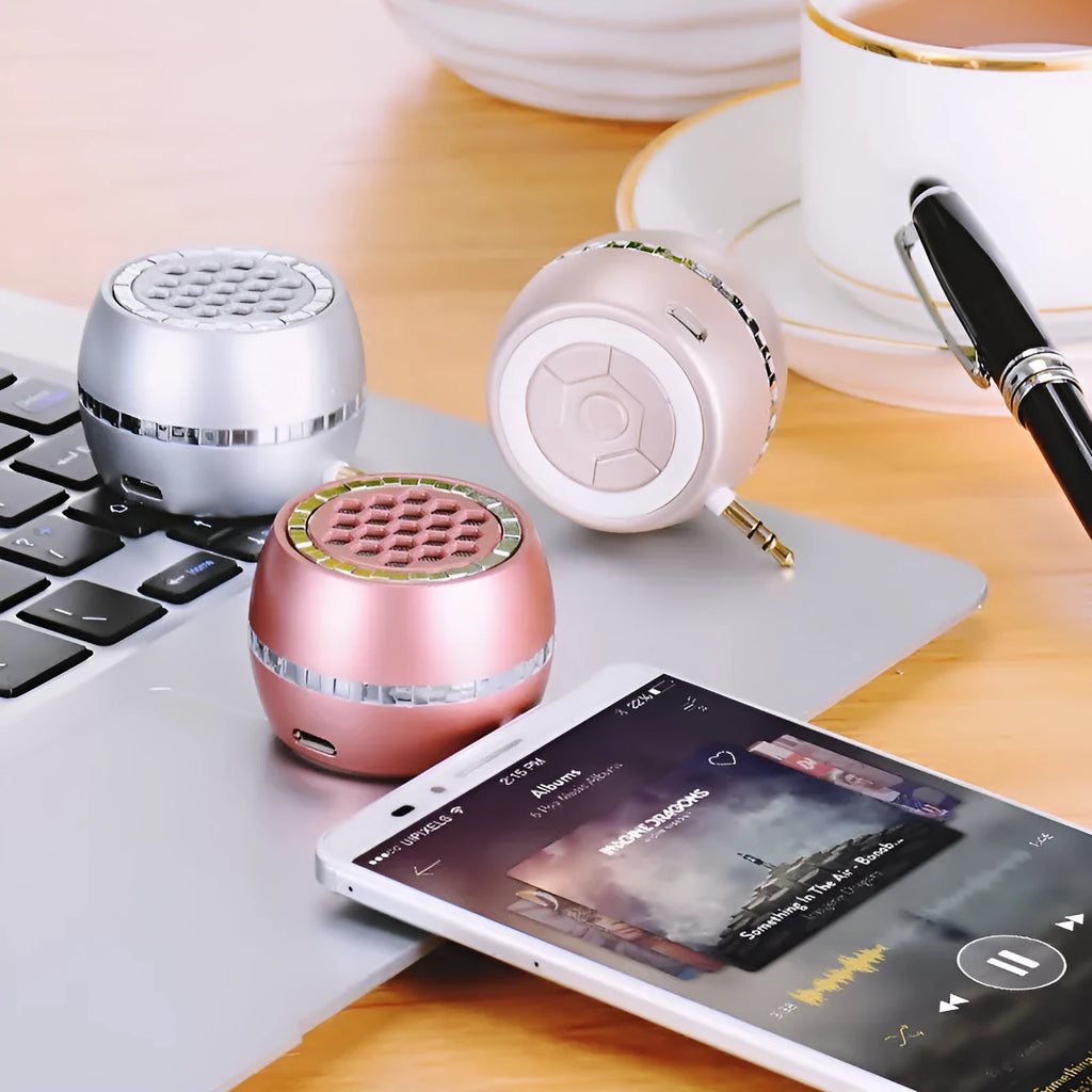 Universal external amplifier speaker in black, gold, and rose gold colours with 5V power input