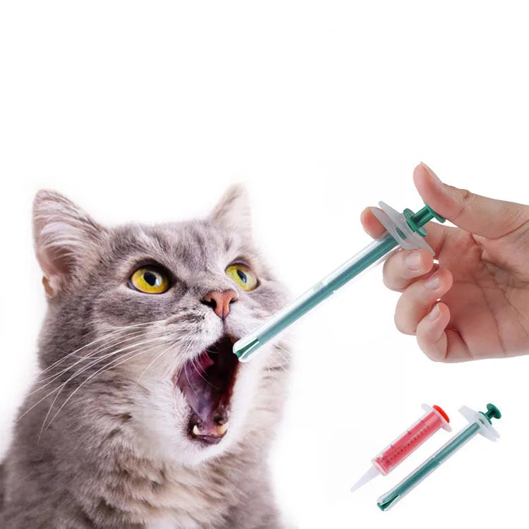 Two pet pill shooter syringes with soft silicone tips for administering tablets to cats and dogs