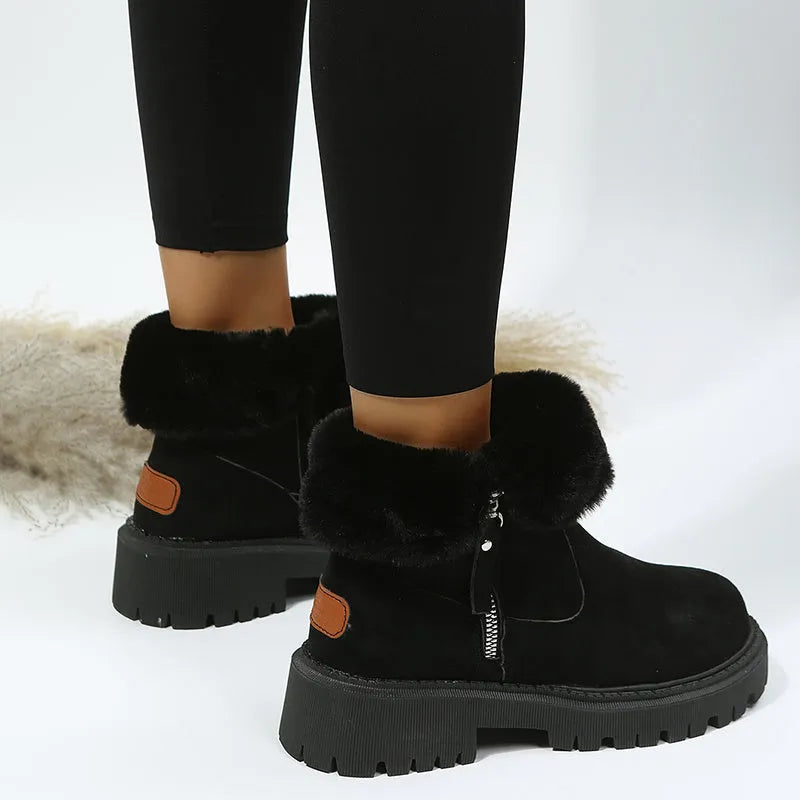 Women's black high-top snow boots with a side zipper and faux suede upper on a rubber sole.