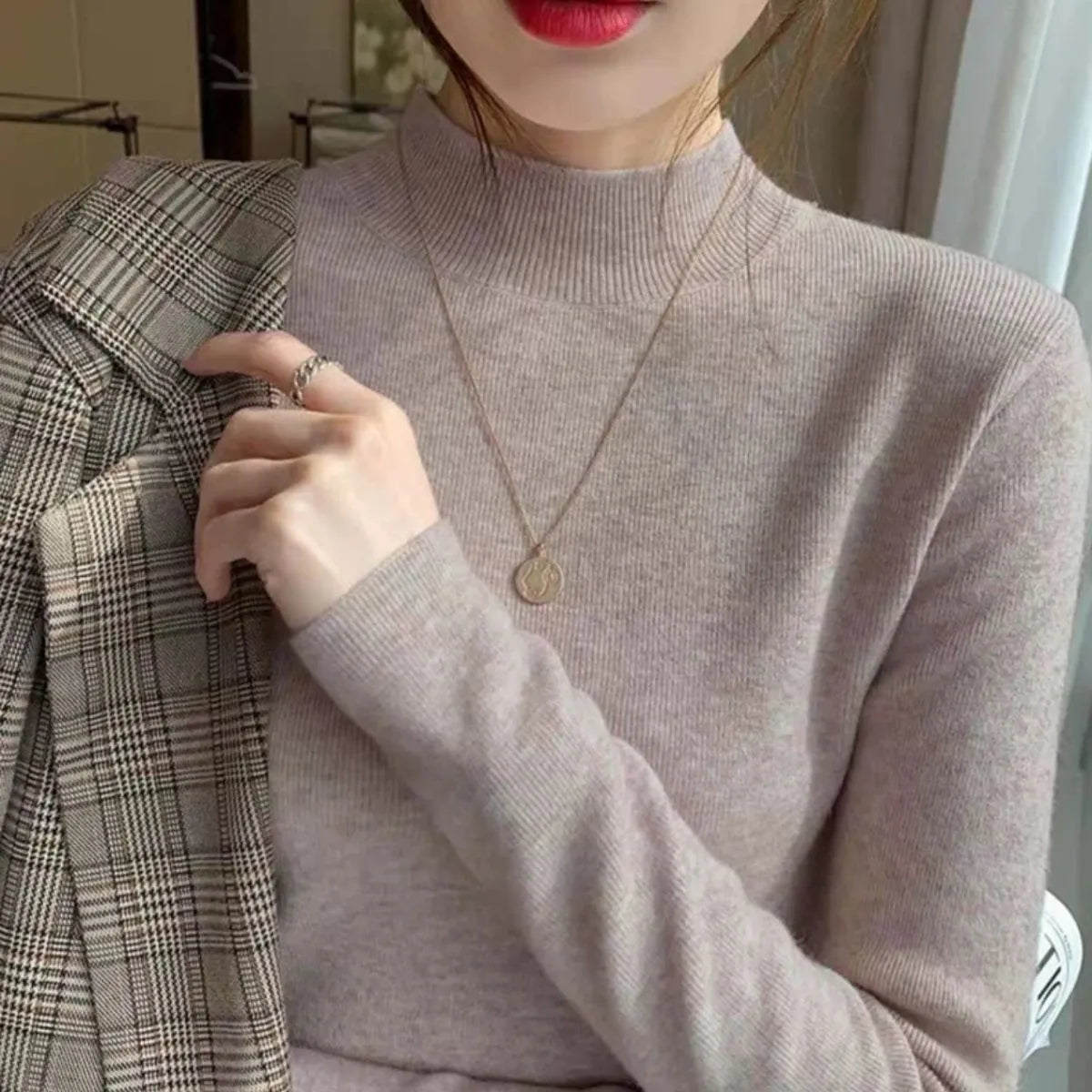 Slim fit long sleeve viscose bottoming shirt in apricot colour on a hanger