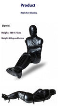Black patent leather bondage kit with full-coverage garment and six ratchet tie-down straps