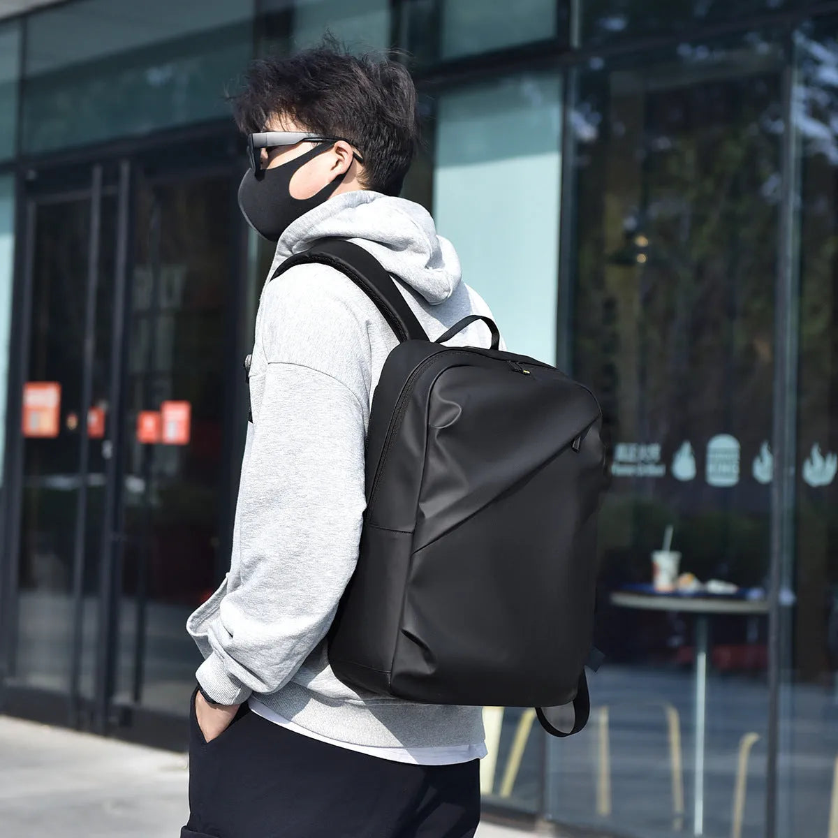 Large capacity waterproof backpack in black blue or grey colours made from PU leather with simple design