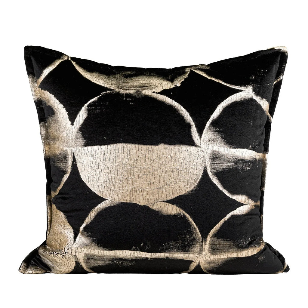 Black gold abstract pattern decorative flannel cushion on a sofa, showing removable cover.
