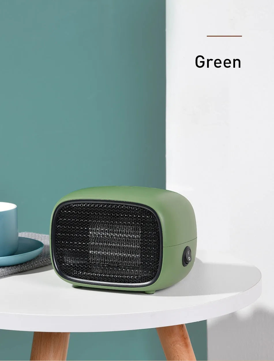 Mini ceramic desk heater in green colour showing compact dimensions