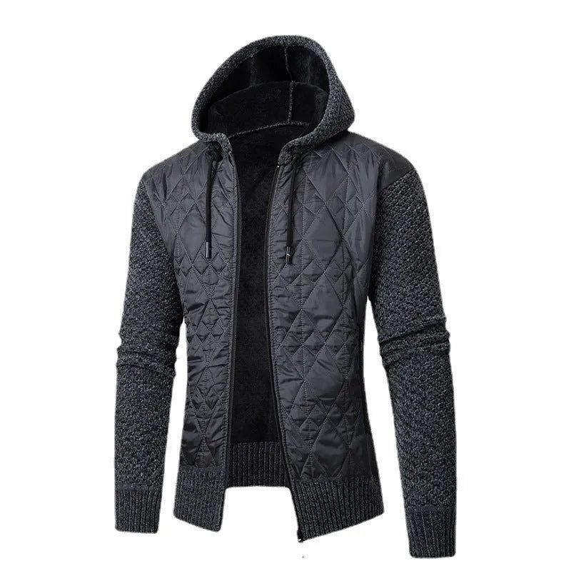 Man wearing a grey hooded zip-front cardigan made of textured wool corduroy with a cinched waist.