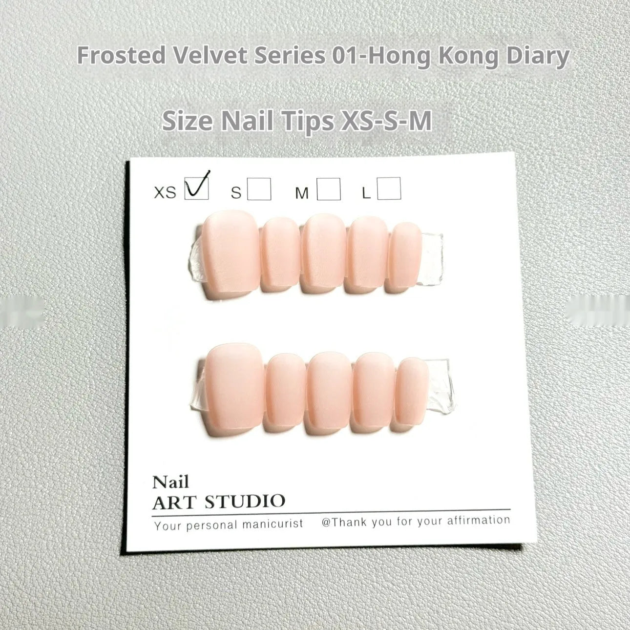 Cat's Eye Aurora false nails with frosted velvet pattern in short ladder shapes on display