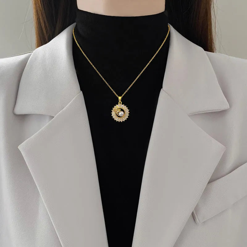 Women's titanium steel jewellery set with geometric leaf design necklace and matching earrings