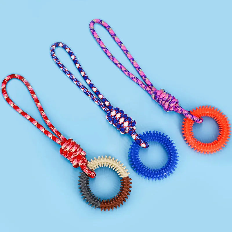 Colourful blue, red, and rose red braided rope dog chew and tug toy, 43 cm long.
