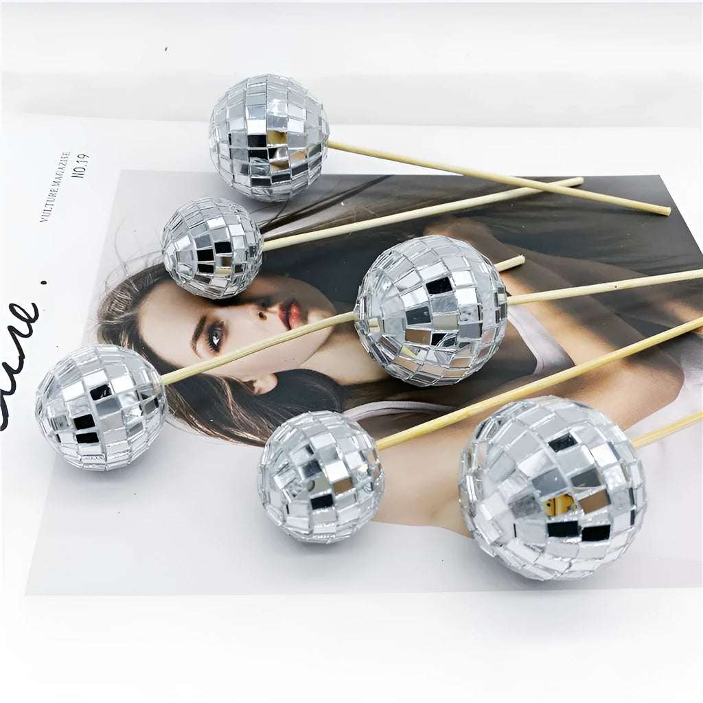Glass mirror ball cake decoration on a wooden stick in various sizes for birthday and party cakes.