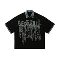 Men's loose blue cotton top with a short sleeve and an asymmetric lapel featuring a graffiti print.