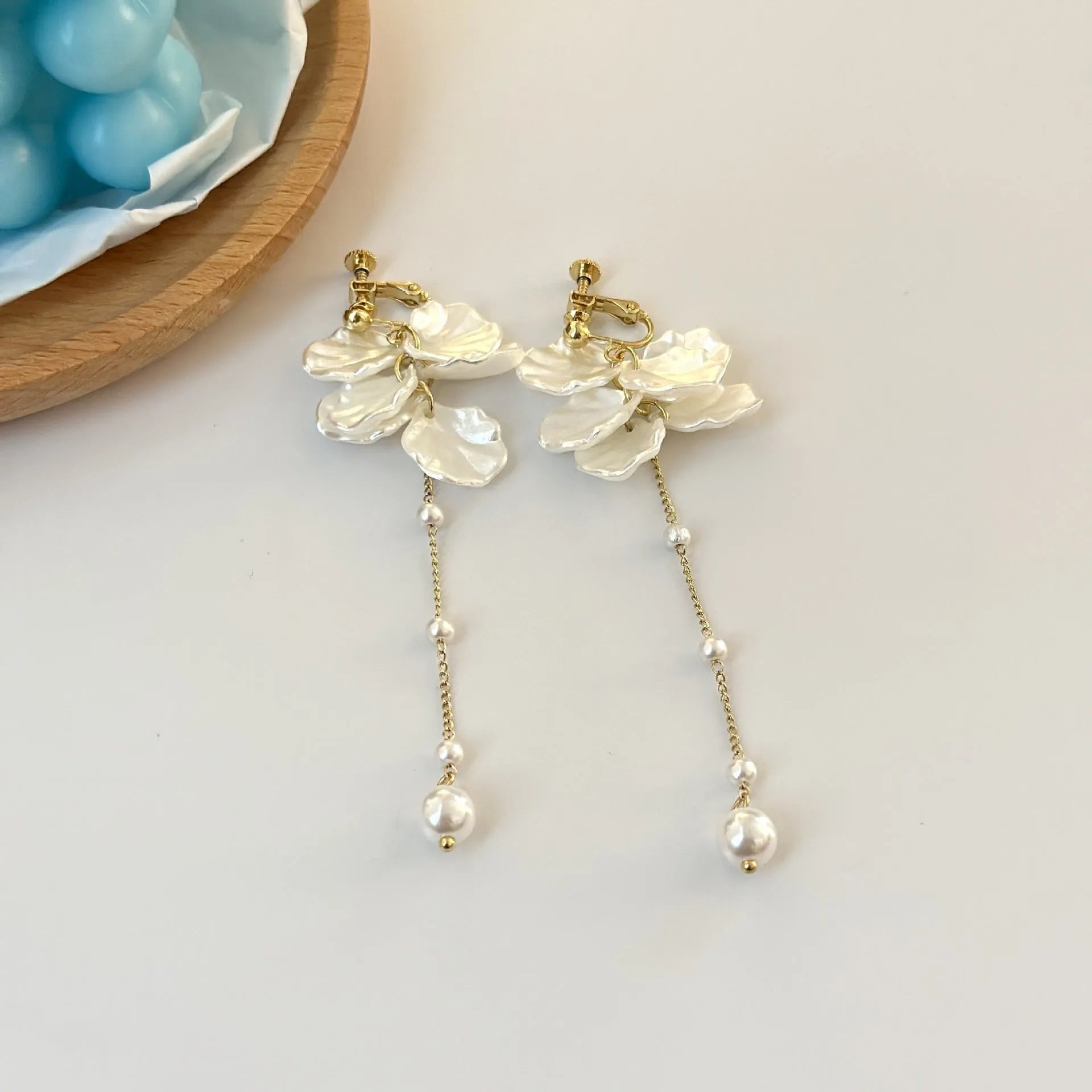 Women's acrylic earrings with pearl and shell tassel design measuring 8.8cm length
