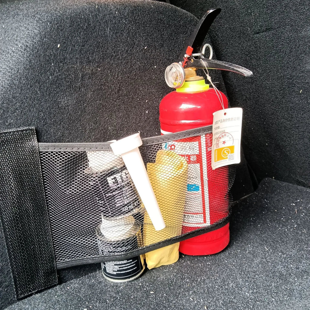 Car trunk elastic storage net organising loose items in vehicle boot